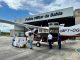 Imagem mostra avião da Polícia Militar, redistribuindo vacina da dengue para 10 municípios da Bahia