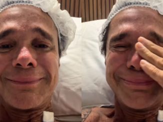 Close do rosto do cantor Netinho com expressão de choro e olhos marejados durante vídeo.